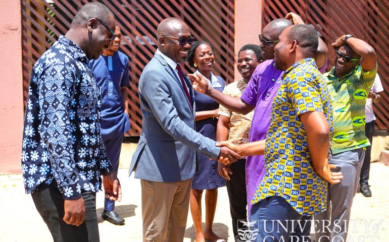 Prof. Denis Aheto(in suit) - Acting Vice-Chancellor, sharing handshake with some faculty members of SoPPS