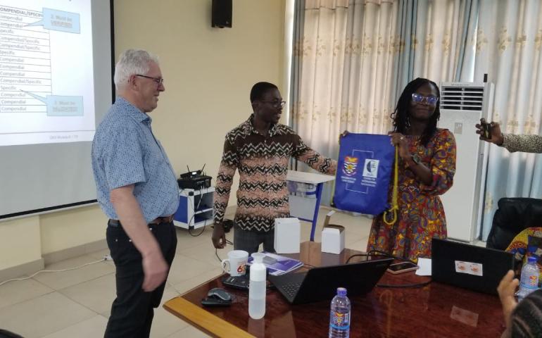 Jos Kessels receiving a gift of appreciation from the Prof. Elvis Ofori Ameyaw and the Mrs Esther Nimo